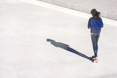 Woman standing on railing