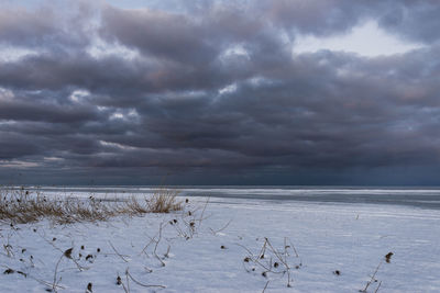 Scenic view of sea against sky during winter