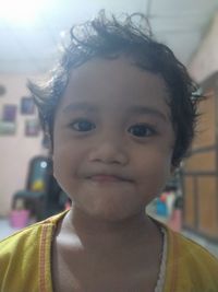 Close-up portrait of cute baby at home