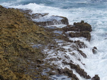 High angle view of rocks in sea