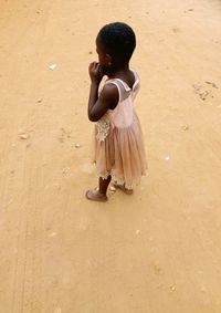 Rear view of woman standing on street