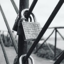 Close-up of padlocks on railing