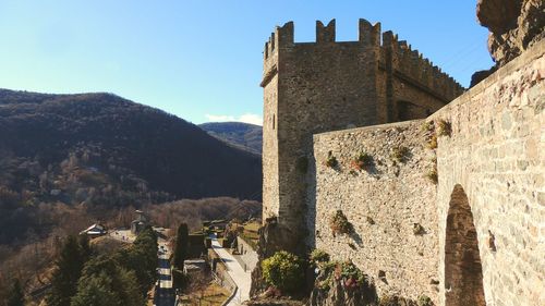 Castle against mountain range