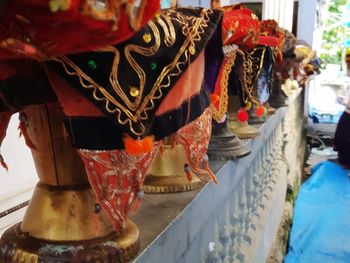 Close-up of clothes hanging in market for sale