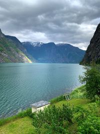 Scenic view of lake and mountains against sky