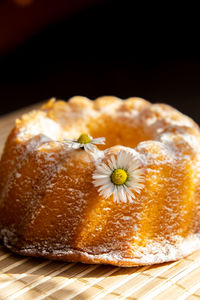 Cupcake decorated chamomile flower in the rustic style. authentic photo. easter concept greeting
