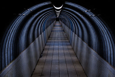 Empty footbridge in tunnel