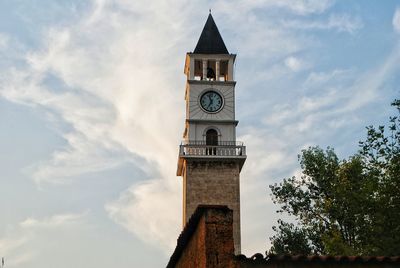 Low angle view of clock tower against sky