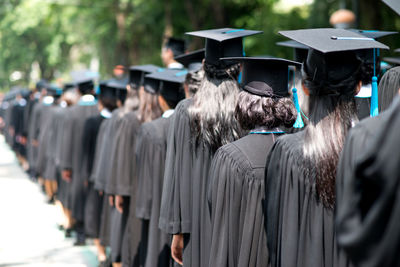 Rear view of people at graduation ceremony