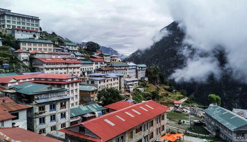 High angle view of buildings in city against sky