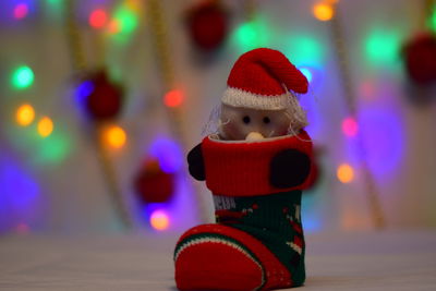 Close-up of illuminated christmas lights in snow