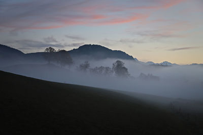 Scenic foggy view of mountains