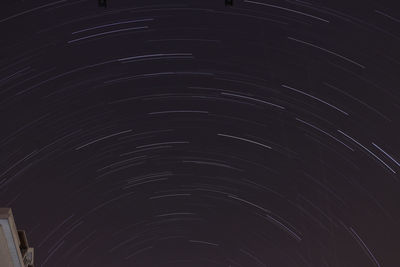 Low angle view of illuminated lights at night