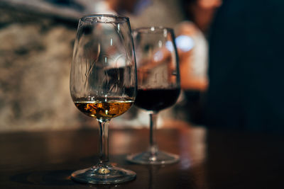 Close-up of wineglasses on table