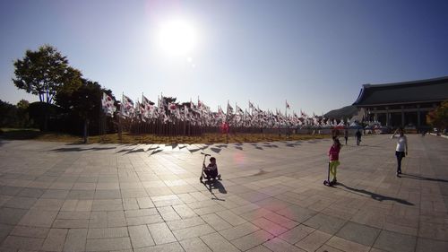 People at town square against clear sky