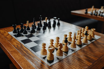 Close-up of chess pieces on table