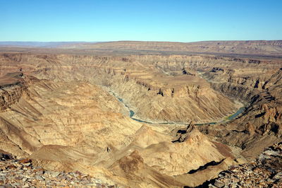 Scenic view of desert against clear sky