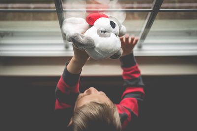 Close-up of boy with toy