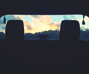 Sunset seen through car windshield