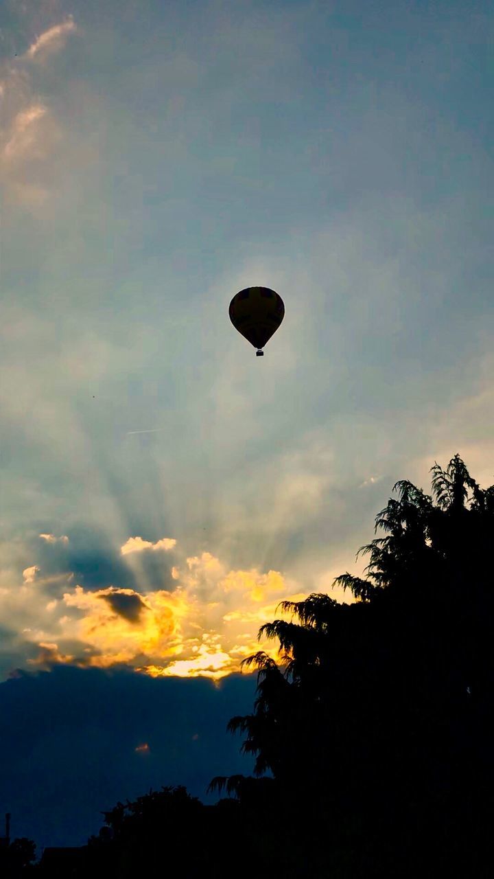 SILHOUETTE OF HOT AIR BALLOONS AGAINST SKY DURING SUNSET