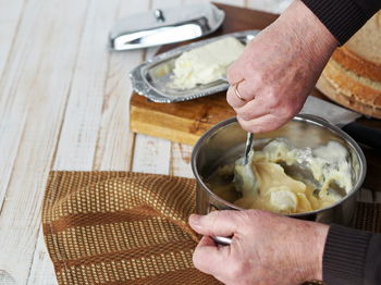 High angle view of man preparing food on table