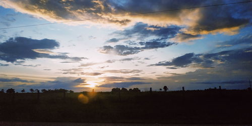 Scenic view of silhouette landscape against sky during sunset