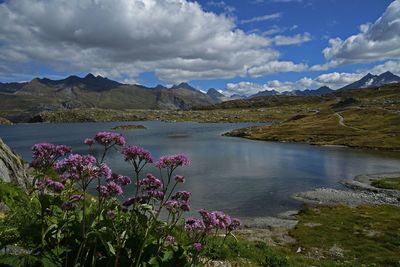 Scenic view of lake against cloudy sky