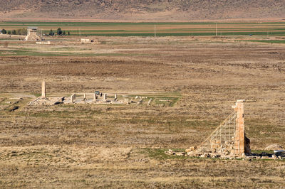 Ancient ruins on field seen from tomb of cyrus