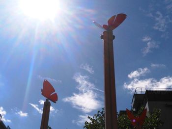 Low angle view of street light against blue sky