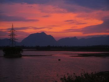 Scenic view of lake against romantic sky at sunset