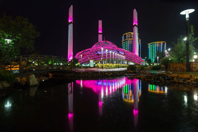 Illuminated buildings in city at night