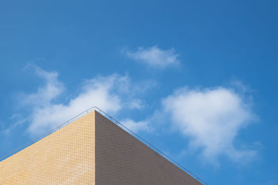 Low angle view of building against blue sky