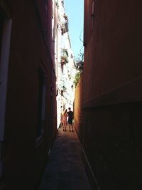 Rear view of people walking on street