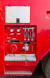 Close-up of red mailbox on wall