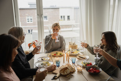 Family raising toast at dinner