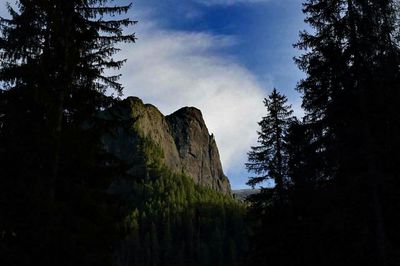 Scenic view of mountains against cloudy sky