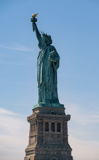 Low angle view of statue against sky during sunset