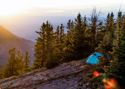 Scenic view of tent on mountain against sky