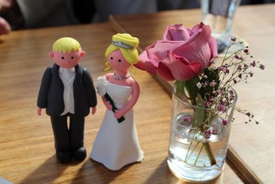 Close-up of figurine newlywed couple on table