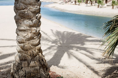 Close-up of stone stack on sand at beach