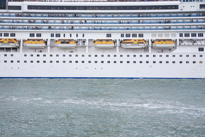 Close-up of yellow building by sea