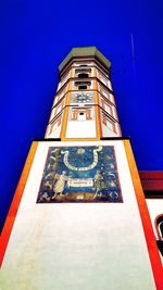 Low angle view of built structure against blue sky