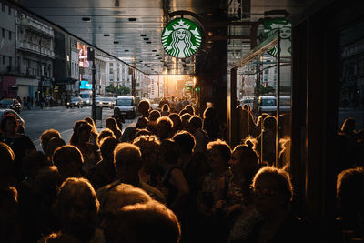 People on street in city at night