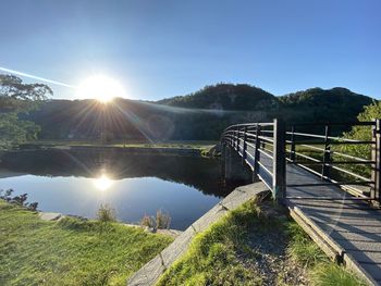 Scenic view of footbridge against sky