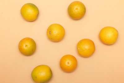 Directly above shot of oranges on white background