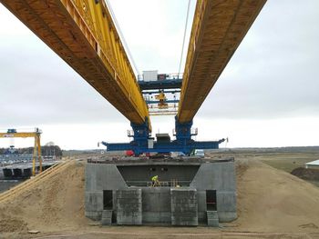 Bridge against sky in city