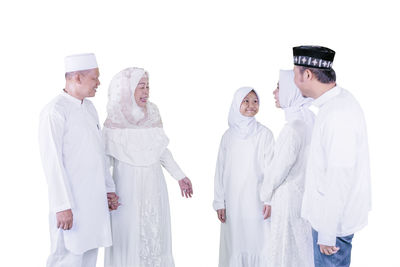 People standing against white background