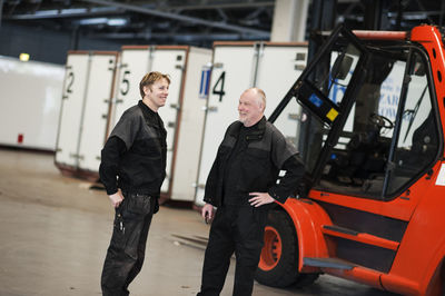 Two men talking in warehouse