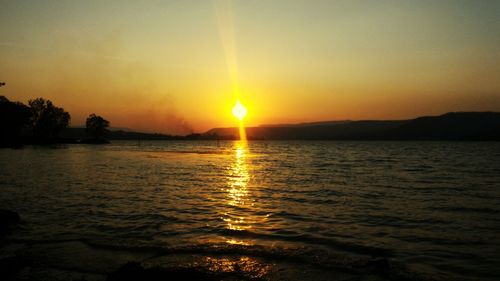 Scenic view of sea against sky during sunset