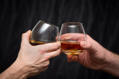 Close-up of hand holding wine glass